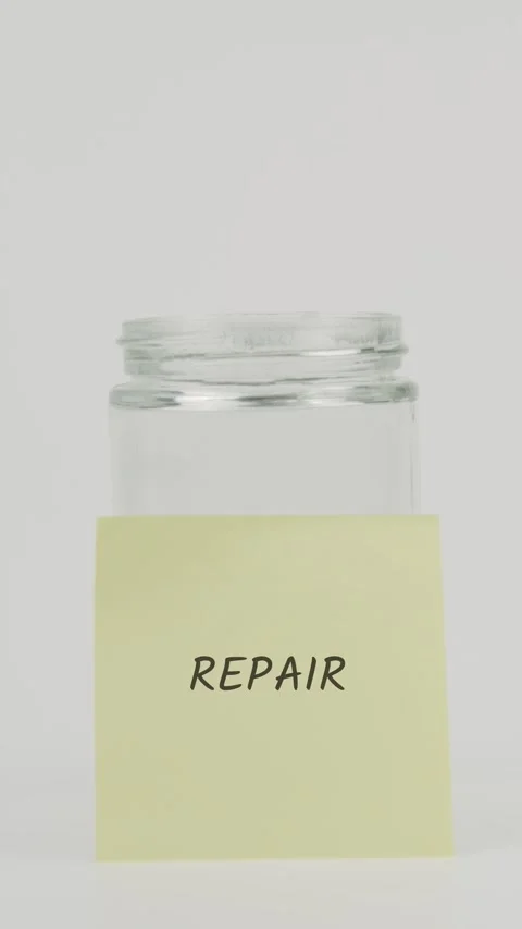 CRO Text or word on yellow sticky note attached to glass jar with hand Stock Footage 311704816