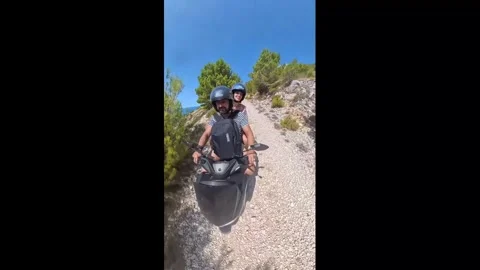 Croatia: Couple's scooter ride ends in slow tumble on gravel road in Last... Stock Footage 341333552