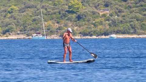 Croatia, Marina, Split-Dalmatia, August 21, 2019. Man with a naked torso Stock Footage 124497345