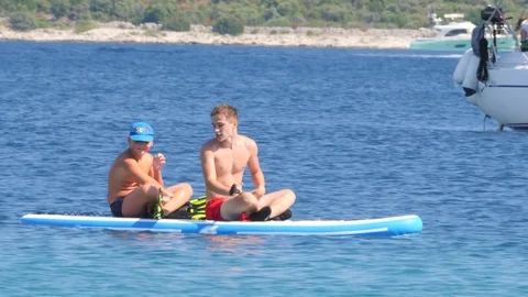 Croatia, Marina, Split-Dalmatia, August 21, 2019. Two young boys have fun Stock Footage 124687434