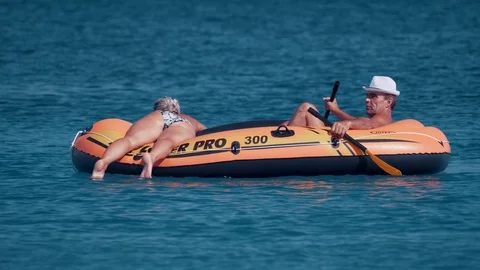 Croatia, Marina, Split-Dalmatia, August 21, 2019. Man in inflatable rubber Stock Footage 124698479