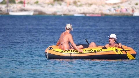 Croatia, Marina, Split-Dalmatia, August 21, 2019. Man in inflatable rubber 库存影片 124698571