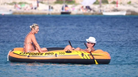 Croatia, Marina, Split-Dalmatia, August 21, 2019. Man in inflatable rubber Stock Footage 124698678