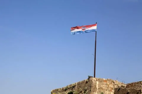 Croatia national flag evolves over the fortress Foto stock
