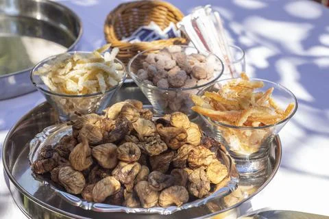 Croatian sweets presented on a plate. Dried fruits like figs, lemons, oranges Stock Photos
