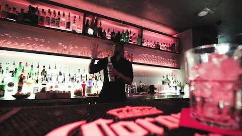 Crobatic barman performing exhibition move at night club. Stock Footage 95942597