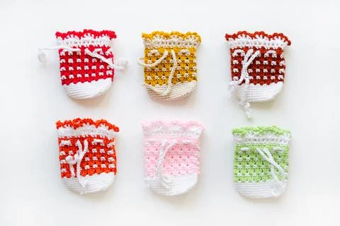 Crochet colored bags. Easter egg sacks. Handmade Stock Photos