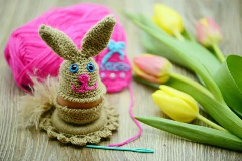 Crochet Easter bunny egg cup made of wool Stock Photos