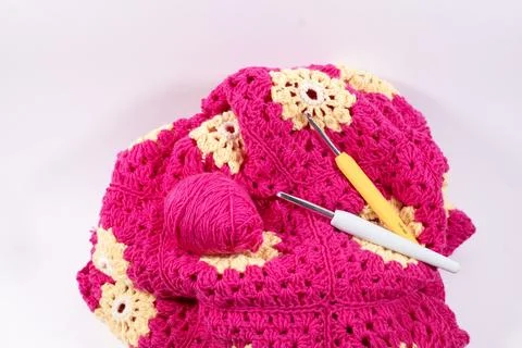 Crochet handmade granny square pattern, crocheting supplies. Stock Photos