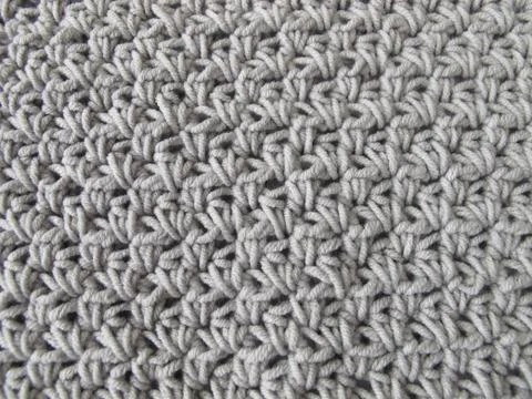 Crochet pattern background in grey Stock-Fotos