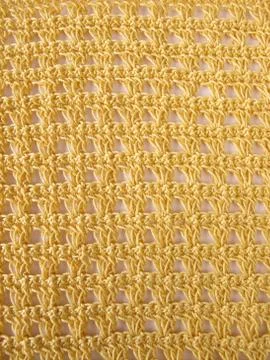 Crochet pattern background in yellow Stock Photos