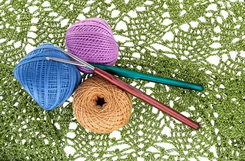Crochet pattern, ball of wool yarn and crochet hook. Stock Photos