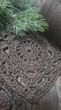 A crochet pattern of brown squares, perfect for home decor and fashion. On a  Stock Photos