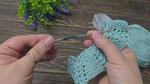 Crochet pattern using colored yarn. Garment and bag details, handmade. Tutorial. Stock Footage 344932347