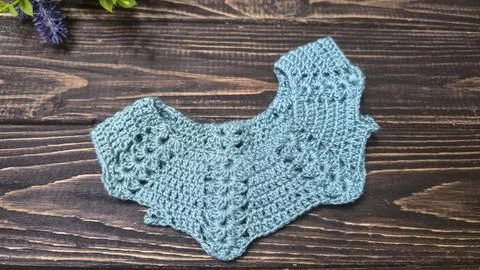 Crochet pattern using colored yarn. Details of the handcrafted item and bag.  Stock Photos