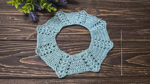Crochet pattern using colored yarn. Details of the handcrafted item and bag.  Stock Photos