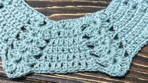 Crochet pattern using colored yarn. Details of the handcrafted item and bag.  Stock Photos