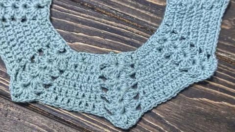 Crochet pattern using colored yarn. Details of the handcrafted item and bag.  Stock Photos
