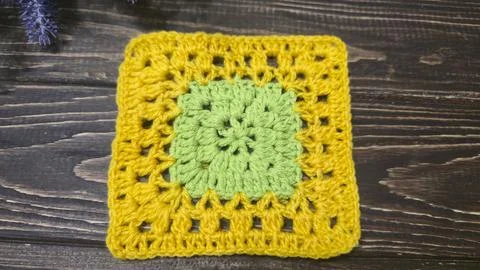 Crochet pattern using colored yarn. Details of the handcrafted item and bag.  Stock Photos