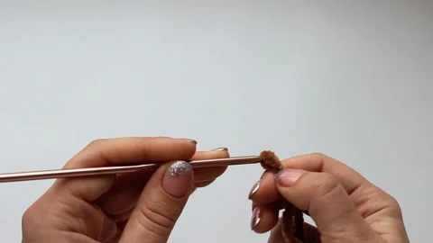 Crochet process of plush yarn. Start knitting a chain of loops Stock Footage 155447118