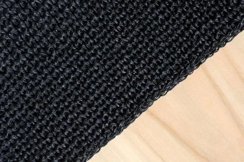 Crochet raffia pattern on wooden background. Stock Photos