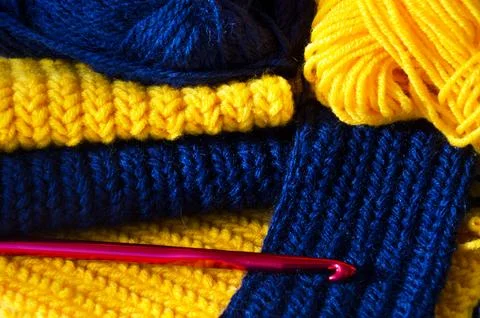 Crochet. Samples of patterns from blue and yellow yarn. Stock Photos