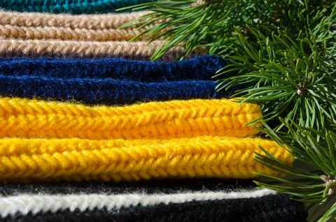 Crochet. Samples of patterns from blue, black, beige and yellow yarn. Stock Photos