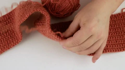 Crochet woolen threads.Dissolves the associated pattern.Unravels double crochets Stock Footage 140804156