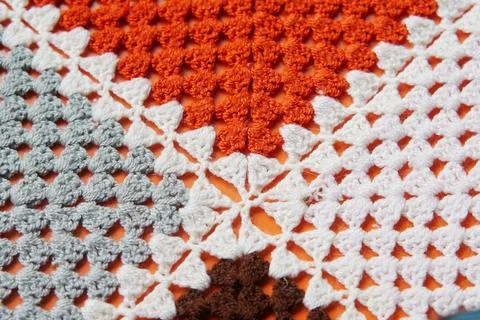 Crochet work shows colorful pattern of yarn and threads 写真素材