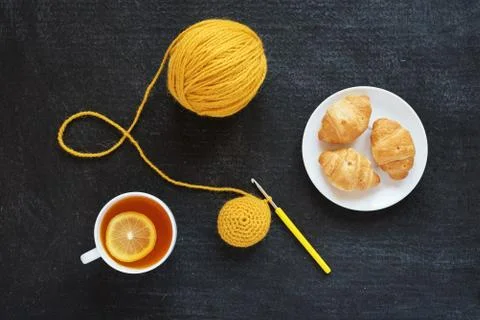 Crocheted element, lemon tea and biscuits Stock Photos