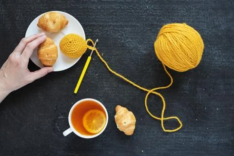 Crocheted element, lemon tea and biscuits Stock Photos