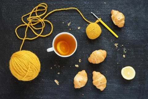 Crocheted element, lemon tea and biscuits Stock Photos