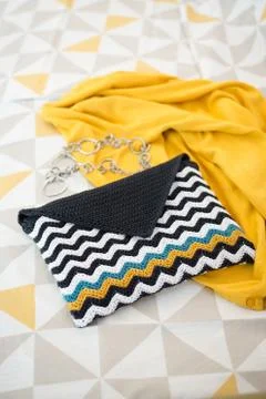 Crocheted Envelope-Style Pouch with Black and White Wave Pattern 스톡 사진