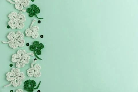 Crocheted Four Leaf Clovers with Sequins.  Saint Patricks Day Decorative Ba.. Stock Photos