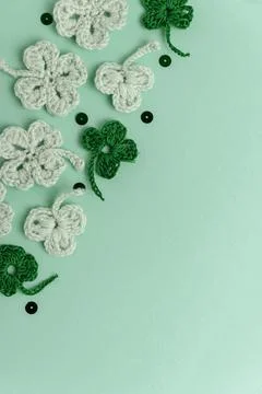 Crocheted Four Leaf Clovers with Sequins.  Saint Patricks Day Decorative Ba.. Stock Photos
