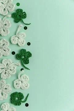 Crocheted Four Leaf Clovers with Sequins.  Saint Patricks Day Decorative Ba.. Stock Photos