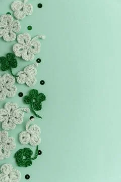Crocheted Four Leaf Clovers with Sequins.  Saint Patricks Day Decorative Ba.. Stock Photos
