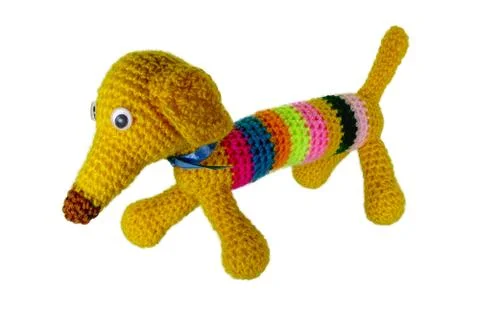 Crocheted multi-colored dog with a long nose Stock Photos
