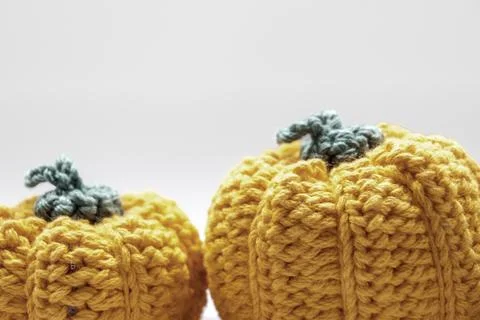 Crocheted pumpkins symbolizing autumn fall holiday decor Stock Photos