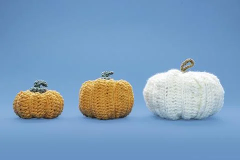 Crocheted pumpkins in various sizes conceptualizing autumn holidays 写真素材