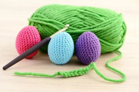 Crocheting easter eggs in green, pink, blue and purple Stock Photos