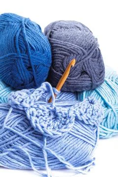 Crocheting isolated Crocheting pattern with blue a balls of yarn closeup C... 库存照片