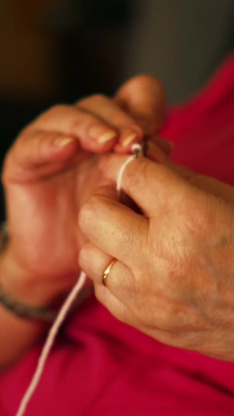 Crocheting white yarn. Stock Footage 345514645