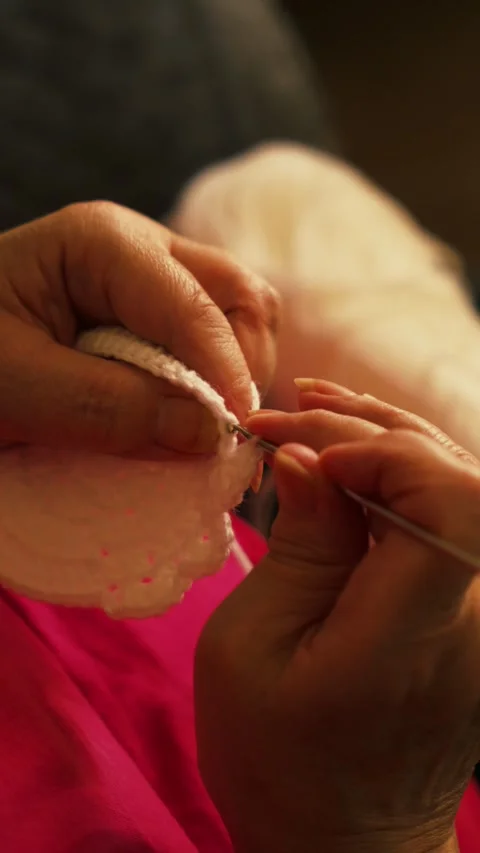 Crocheting white yarn with hook. Stock Footage 345514604