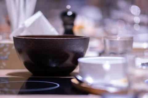 Crockery on the dining table at night Stock Photos