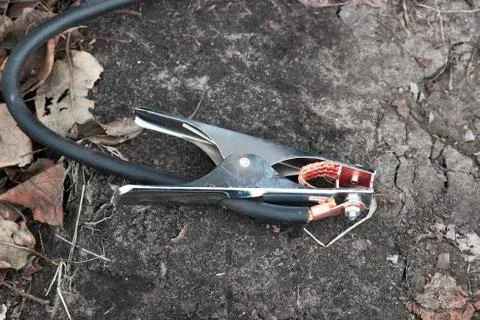 Crocodile clip on ground Stock Photos