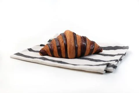 Croisant bread on a table cloth, with chocolate filling, good for recipes a.. Stock Photos