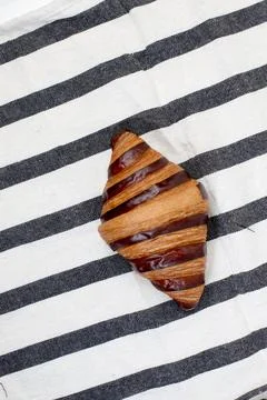 Croisant bread on a table cloth, with chocolate filling, good for recipes a.. Stock Photos