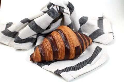 Croisant bread on a table cloth, with chocolate filling, good for recipes a.. Stock Photos