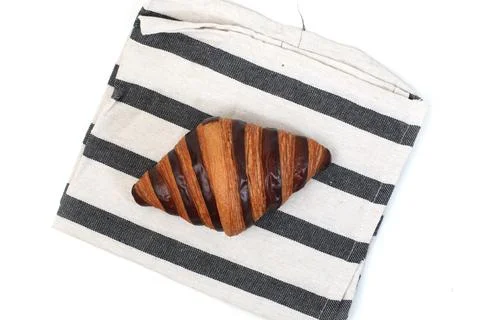 Croisant bread on a table cloth, with chocolate filling, good for recipes a.. Stock Photos